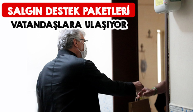 Destek paketlerini bizzat teslim etti