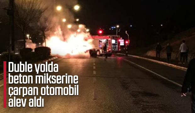 Duble yolda beton mikserine çarpan otomobil alev aldı