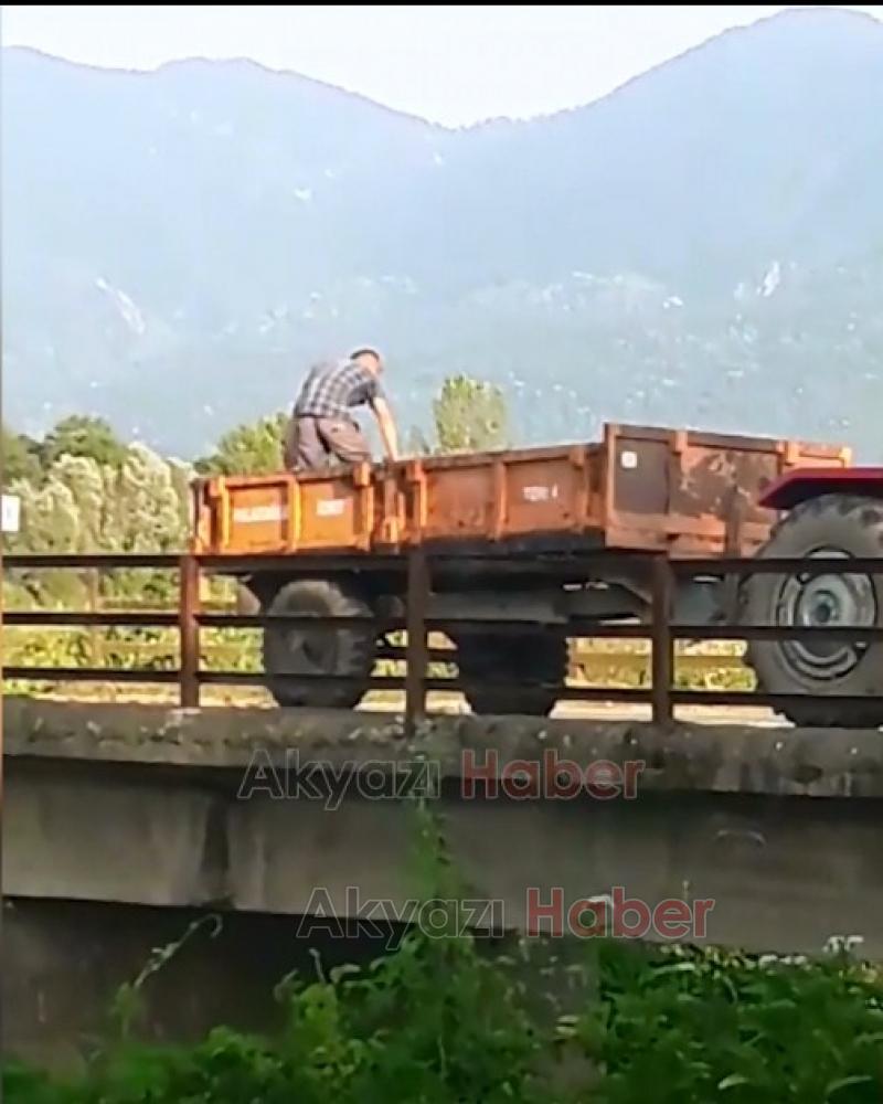 Kurban atıklarını traktörle getirip Dereye attı