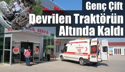 Devrilen traktör altına kalan 2 kişi yaralandı. 