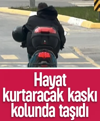 Hayat kurtaracak kaskı kolunda taşıdı