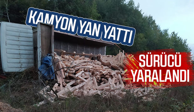 Kamyon yan yattı, sürücü yaralandı