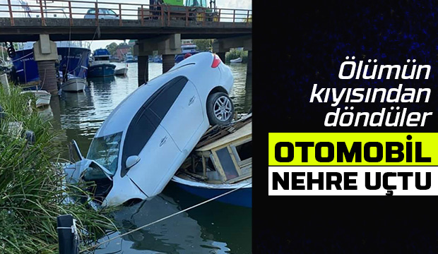 Otomobil nehre uçtu, kayık hayatlarını kurtardı