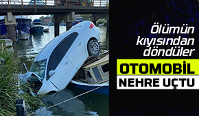 Otomobil nehre uçtu, kayık hayatlarını kurtardı