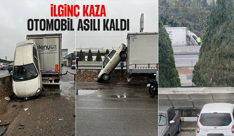 Otomobil tırda asılı kaldı