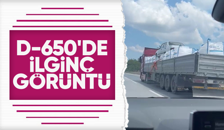 Otomobili çuvalların üzerine koyup taşıdı