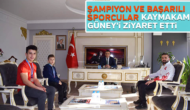 Şampiyon ve başarılı sporcular Kaymakam Güneyi ziyaret etti