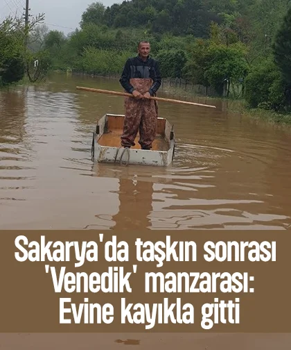 Taşkının yaşandığı mahallede ulaşımı kayıkla sağladı